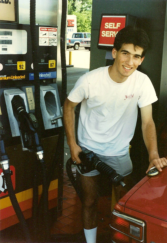 Chris fills up the tank of his 1981 Toyota Tercel.