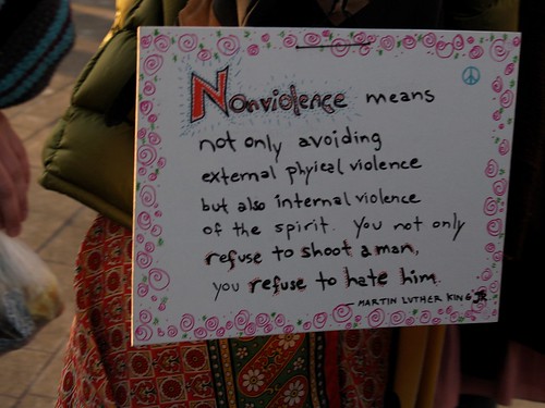 "Nonviolence means not only avoiding external physical violence but also internal violence of the spirit. You not only refuse to shoot a man, you refuse to hate him" Sign (Washington, DC)