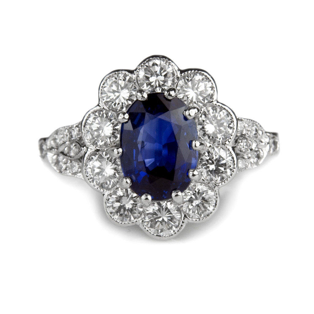 Oval sapphire with diamond cluster engagement ring | Flickr