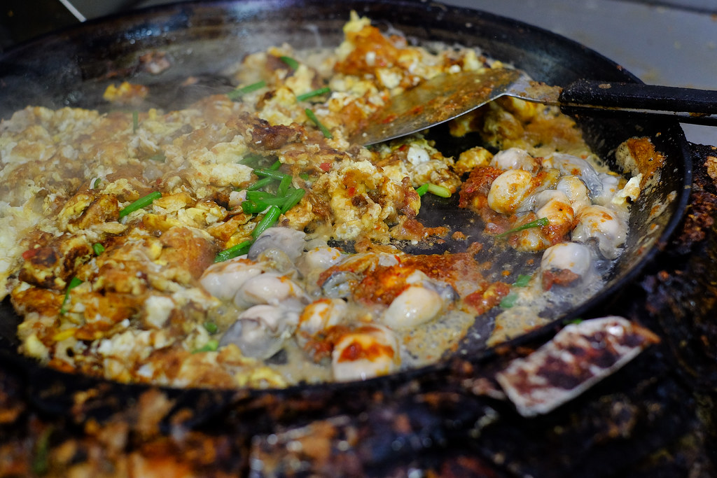 Lim's Fried Oyster: Putting the oyster together with the eggs.