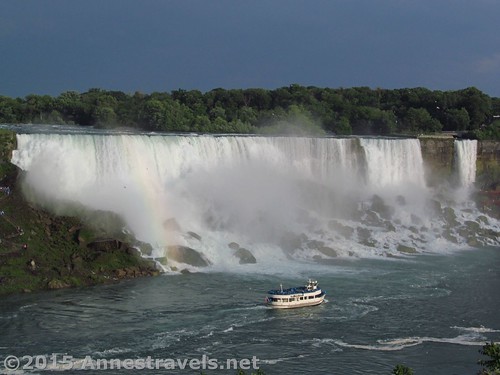 A Maid of the Mist boat motors past the American Falls, Niagara Falls State Park, New York