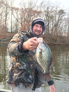 Photo of Man holding a crappie