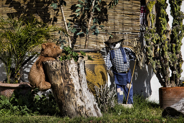 Scarecrow and bear yard art