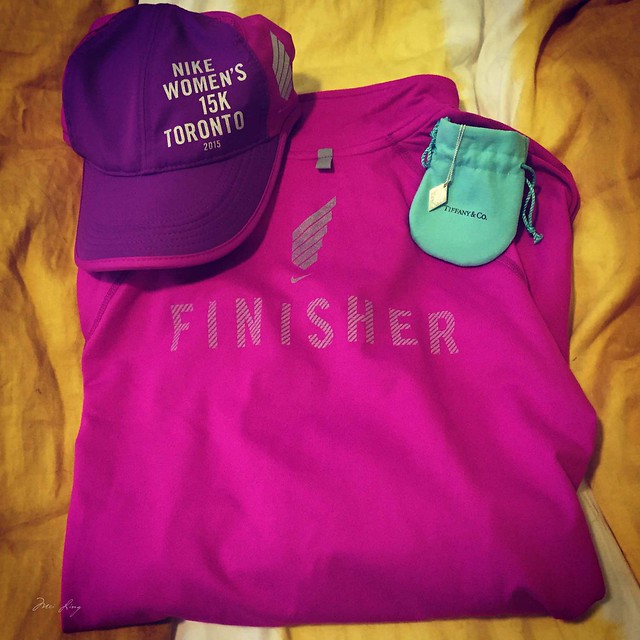 Mei's finisher's merchandise and her finisher's necklace.