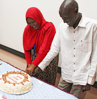 Rasha Adam and her husband Babiker Mohammed cut the cake to celebrate baby BecA