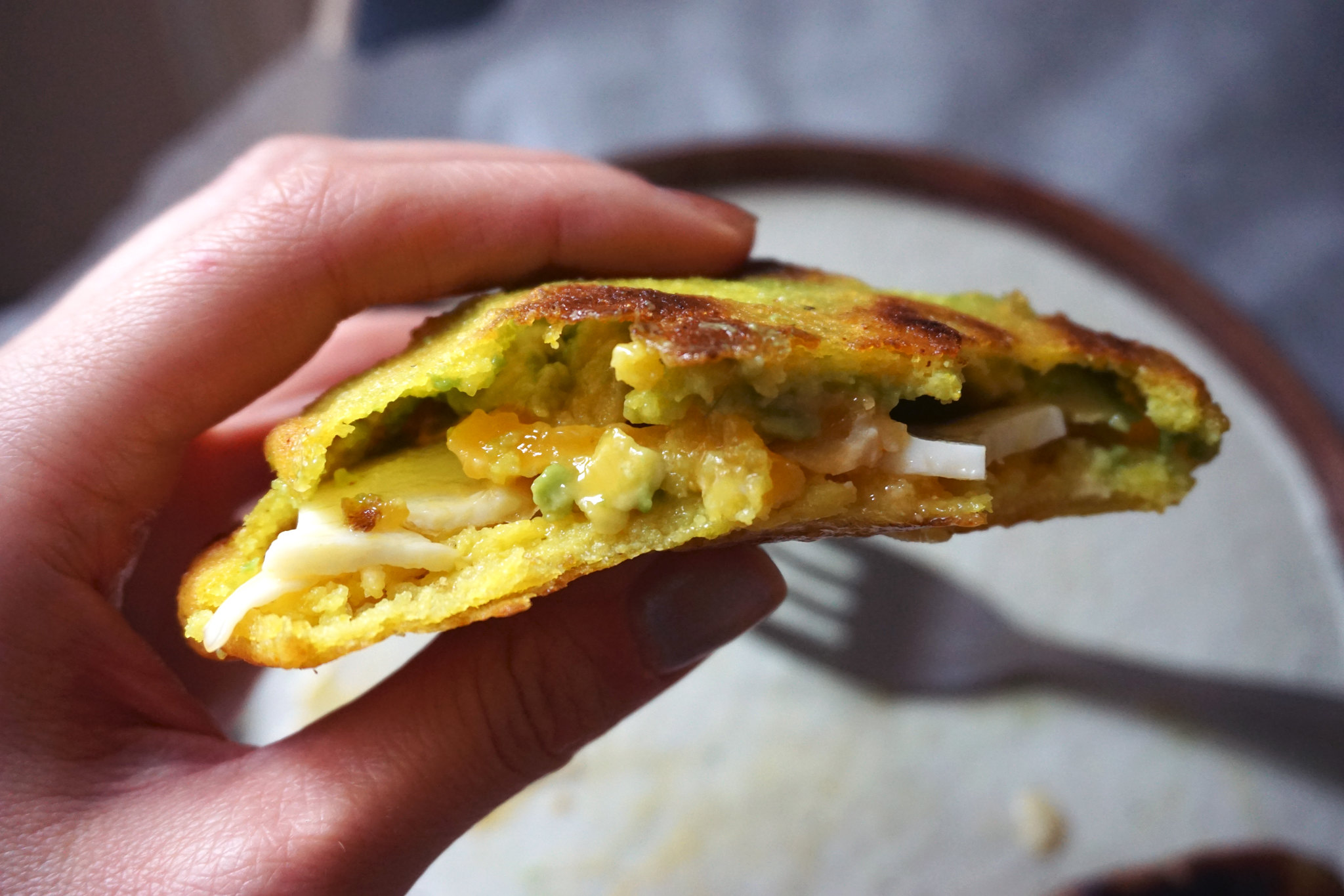 Gluten free arepas with egg, sausage and avocado