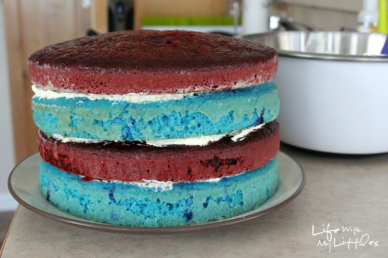 Celebrate the Fourth of July with this easy and delicious patriotic layer cake! It's way easier than it looks, and uses Twizzlers for the decorations!