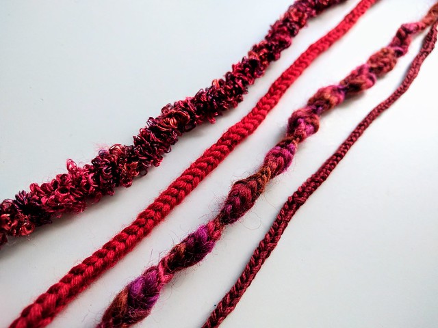 red lucet cords for hearts in different yarns