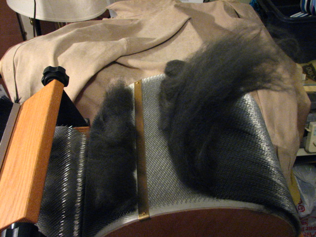 Removing a batt from a drum carder