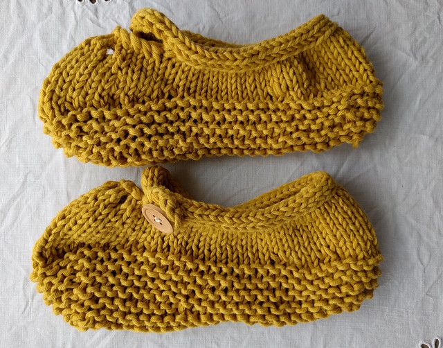 Yellow handknitted mary jane slippers.