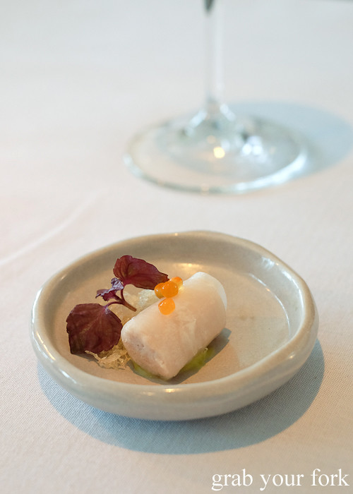 Amuse bouche of pork in daikon roll with crisp potato and salmon roe at Bathers' Pavilion in Balmoral Sydney