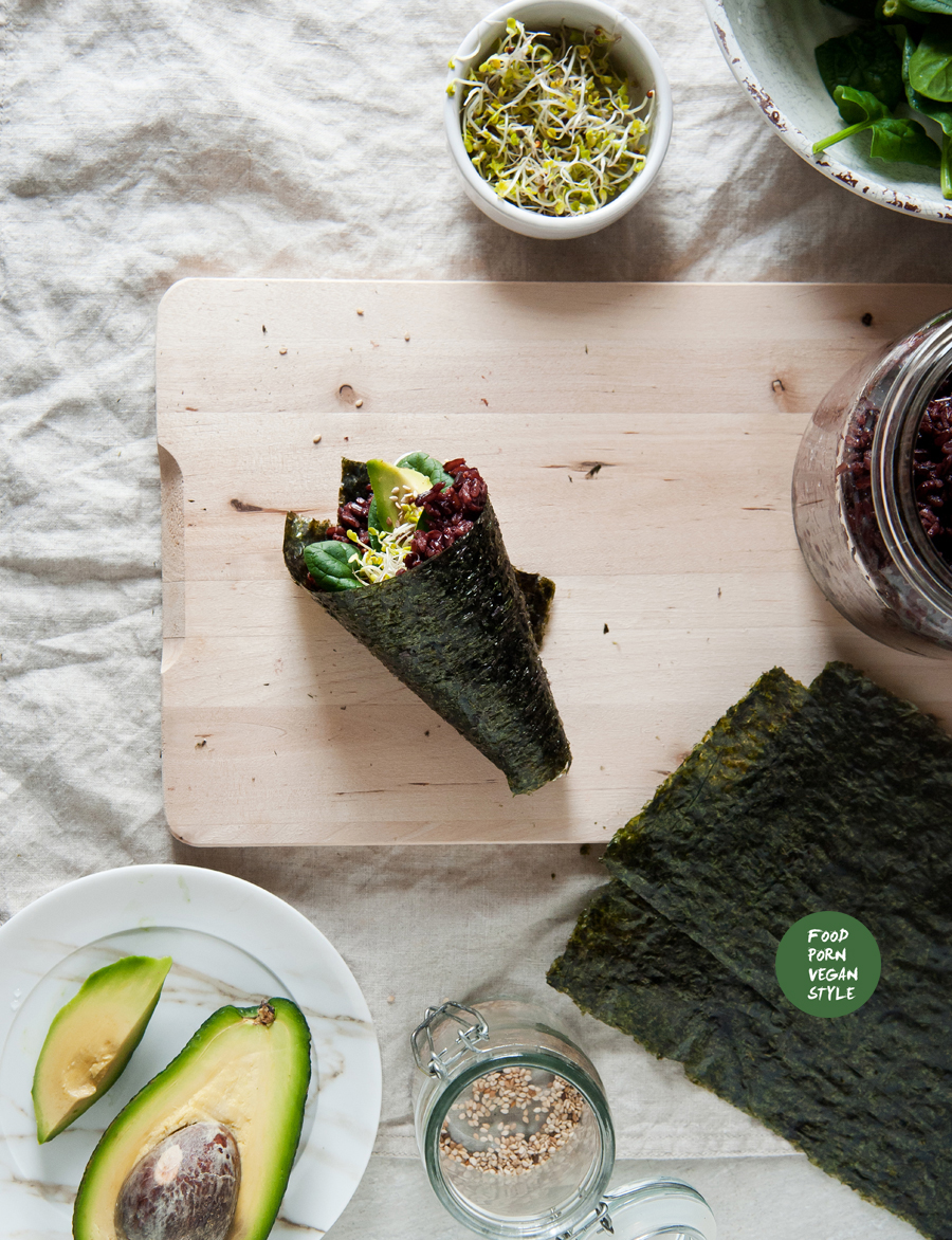 Vegan sushi rolls with black rice, spinach and avocado