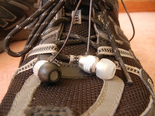 earbuds and running shoes