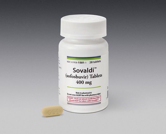 Sofosbuvir_bottle_with_pill_on_Gray-1940x1566