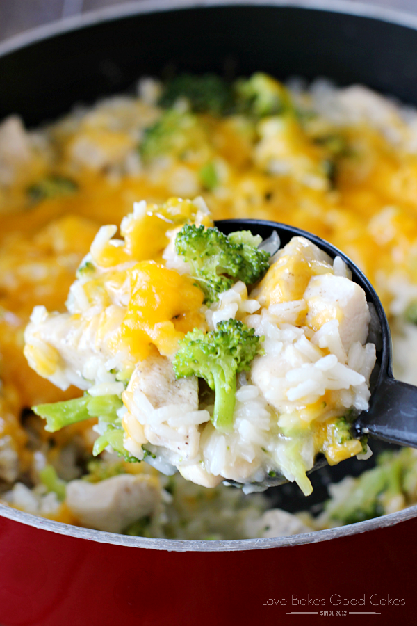 Cheesy Chicken Broccoli & Rice Skillet close up on a spoon.