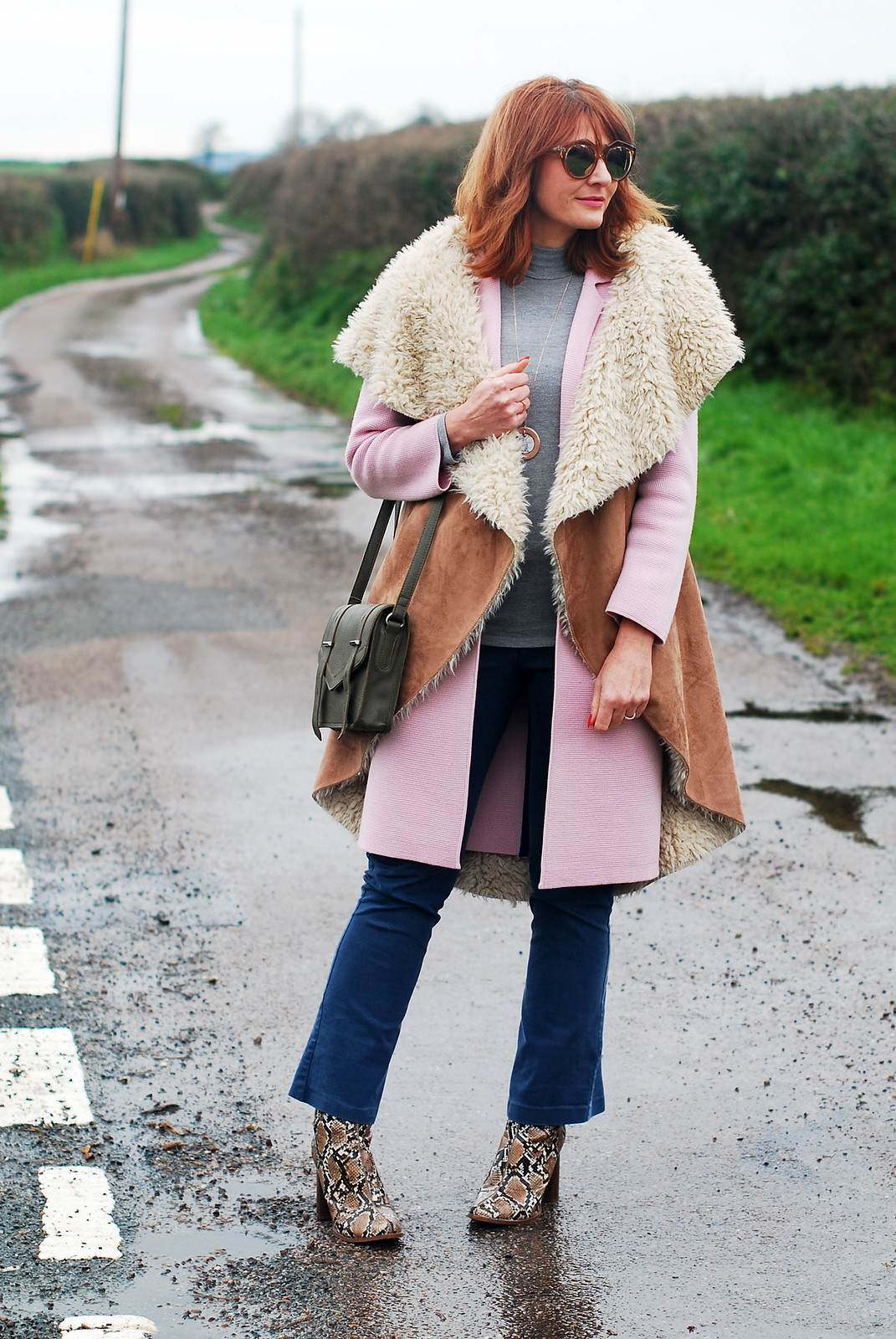 Layered winter outfit oversized faux shearling gilet pink coatigan grey roll neck flared denim trousers snakeskin ankle boots | Not Dressed As Lamb, over 40 style