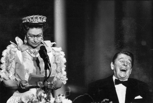 President Ronald Reagan laughs at a joke made by Queen Elizabeth II during a state dinner at the M.H. de Young Museum,