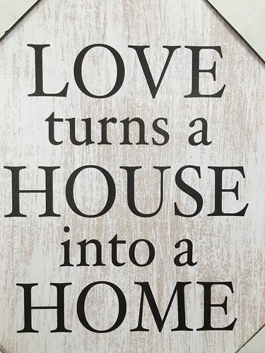 love turns a house into a home, sign