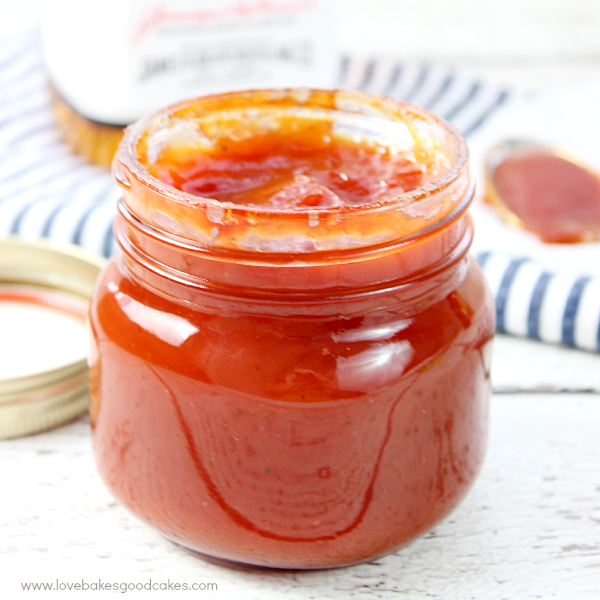 Bourbon Whiskey BBQ Sauce in a glass jar up close.
