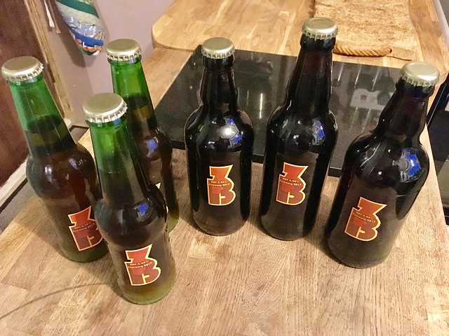 Six bottles of beer with homemade labels