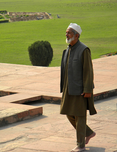 Muslim man out walking in the gardens of the Baby Taj in Agra, India