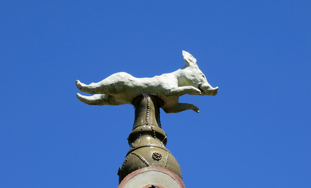 A flying pig whimsically decorates a roof in Giverny, France