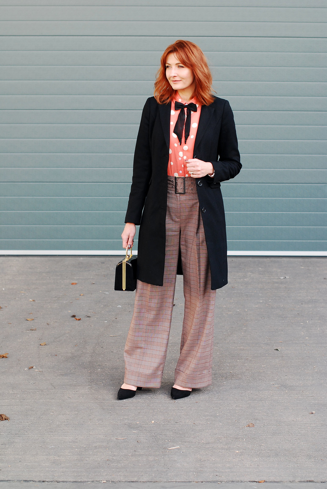 How to get the Katharine Hepburn look: Wide leg check turn up trousers masculine-cut black coat polka dot blouse with embellished black bow neck tie black box handbag cone-heeled black pointed shoes | Not Dressed As Lamb, over 40 style
