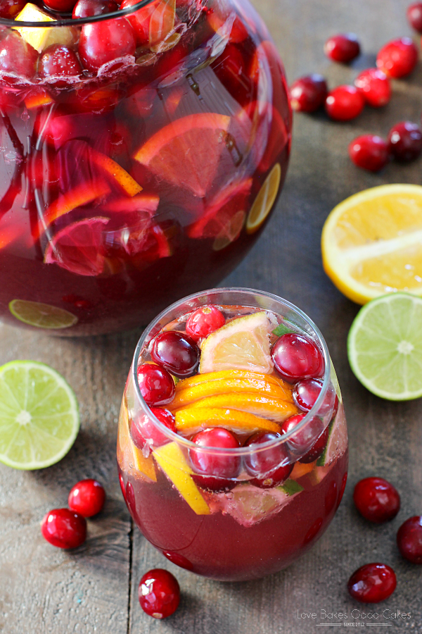 Non-Alcoholic Sangria in a pitcher and a glass with fresh fruit.