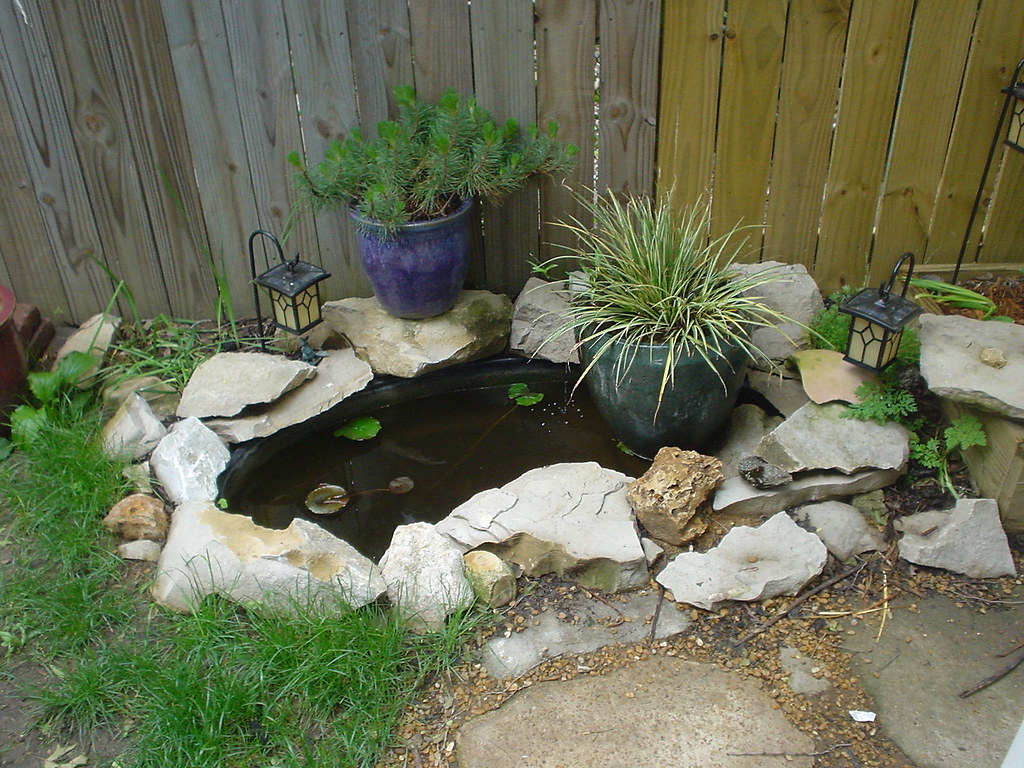 Small koi pond in our backyard | Our small koi pond. We have… | Flickr