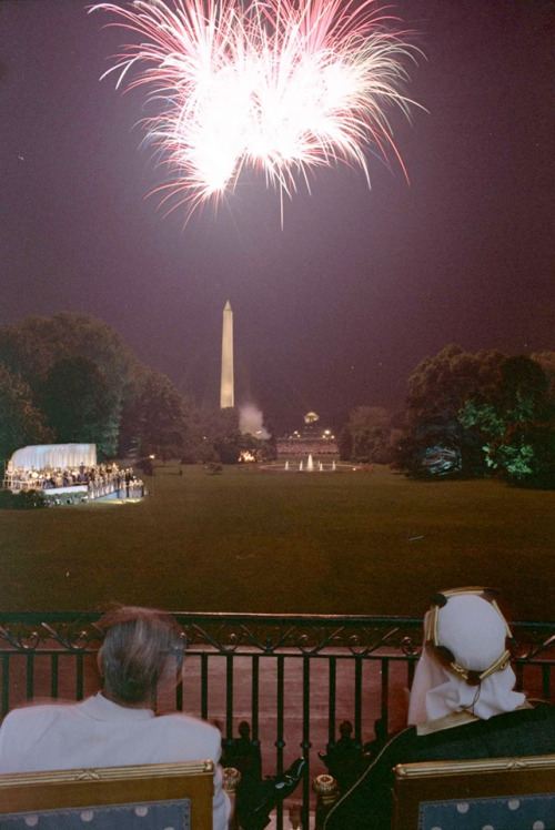 President Lyndon B. Johnson and King Faisal of Saudi Arabia viewing fireworks over the South Lawn from the first floor balcony of the White House. Washington D.C. June 21st, 1966.‎