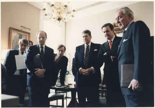 President Ronald Reagan and his staff watch a video of the Challenger disaster. January 28, 1986.