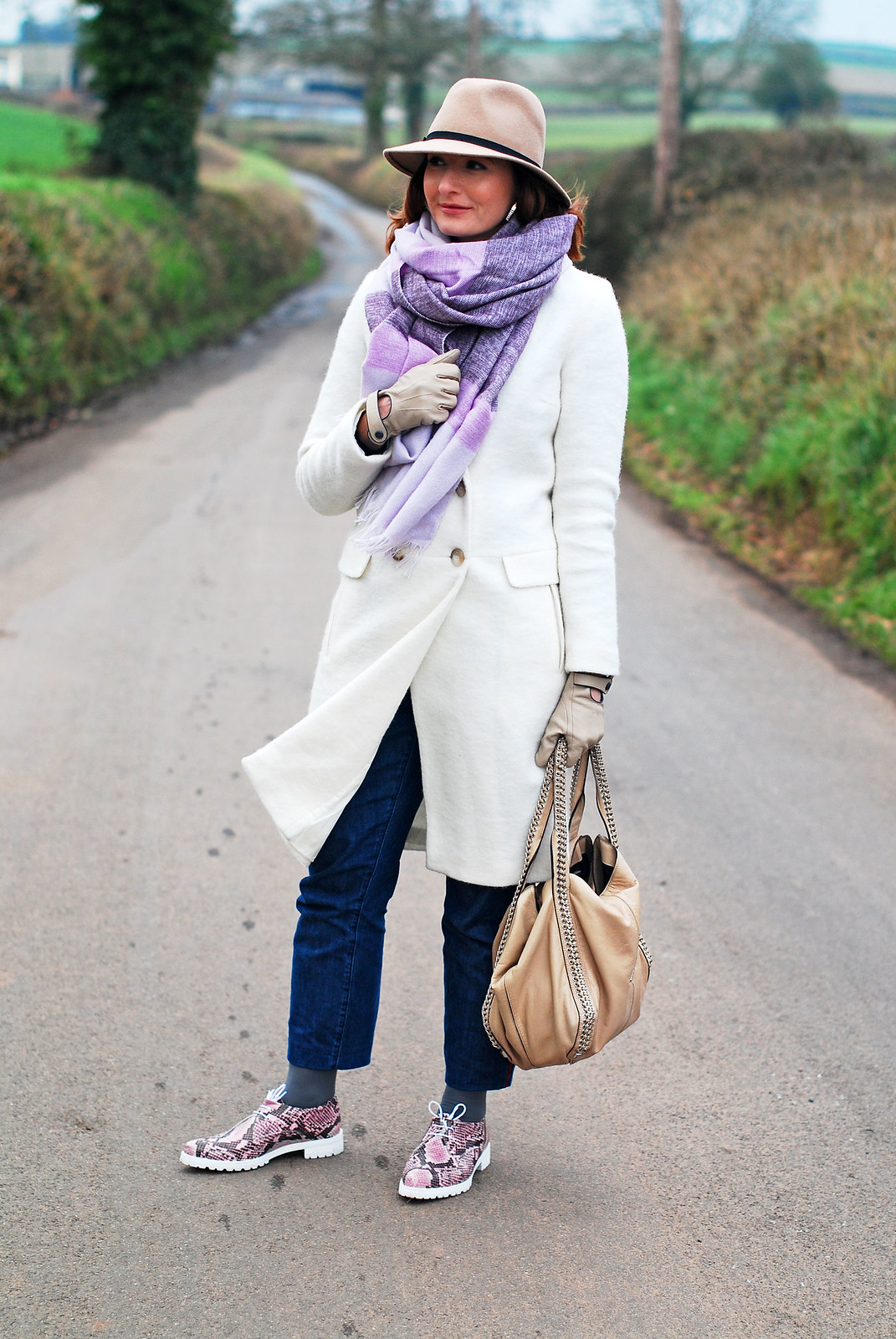 Cold weather outfit: Long white wool coat oversized lilac scarf camel fedora dark wash boyfriend jeans pink snakeskin lace up shoes | Not Dressed As Lamb, over 40 style