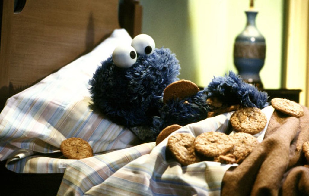 Cookie Monster eating cookies in bed | Tom Simpson | Flickr