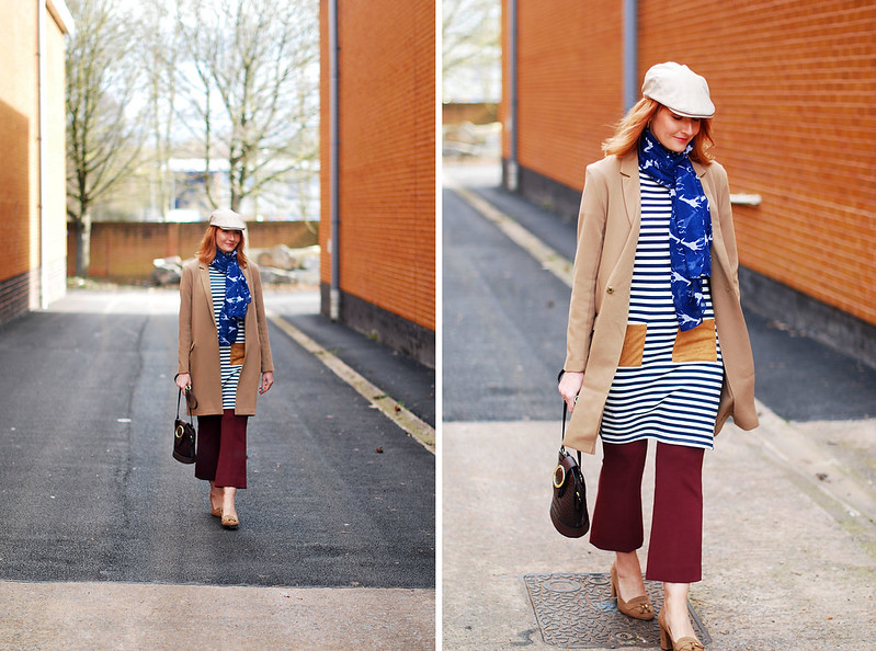 Styling a preppy stripe summer dress in autumn/winter: Camel longline blazer stripe tunic dress with patch pockets kick flare burgundy trousers heeled loafers crossbody bag stone flatcap for women | Not Dressed As Lamb, over 40 style