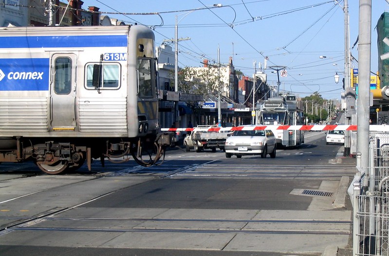 Tram waits for train, Glenhuntly (March 2007)