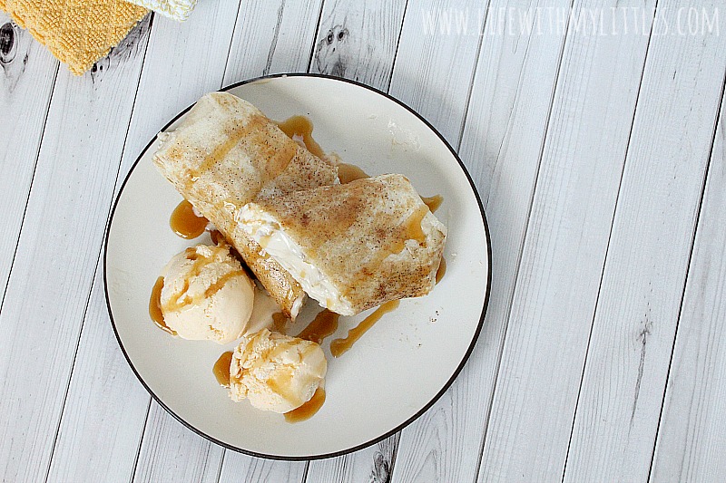 This Applebee's Apple Chimicheesecake copycat recipe tastes just like the original dessert from the restaurant! Warm, gooey apple cheesecake tucked inside a cinnamon sugar tortilla and fried until golden, served with creamy vanilla ice cream and drizzled in caramel! Yum!