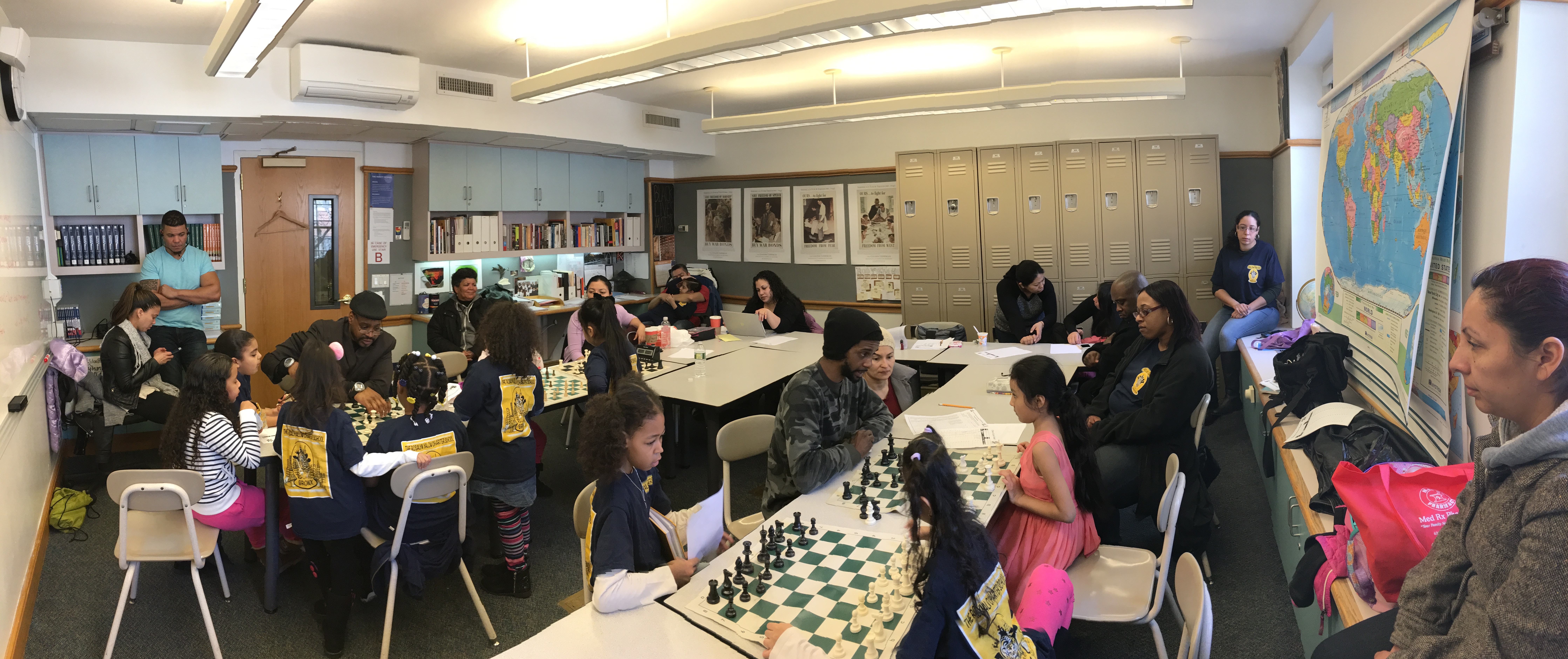 Students review games with coaches between 5 rounds