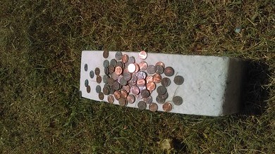 Pennies on John Wilkes Booth headstone