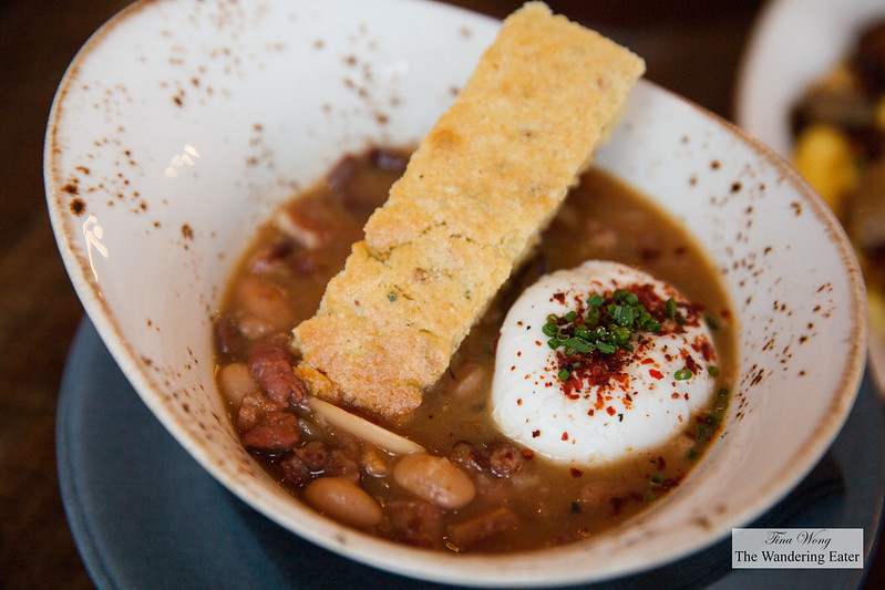 Breakfast Cassoulet - Braised Heirloom Beans, Chicken Demi, Fingerling Potatoes, House Sausages, Bentons Bacon, Poached Egg, Jalapeno and Sage Corn Bread Crouton
