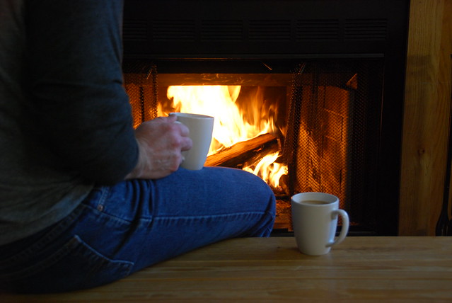 Enjoying a cup of coffee by the fire at cabin 5 Lake Anna State Park, Virginia