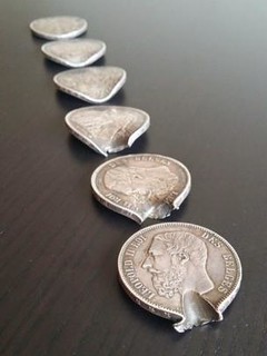 Coins that stopped a bullet lined up