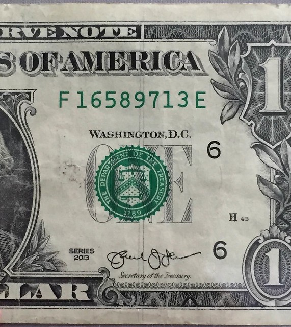Dollar bill with vertical lines closeup