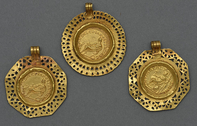 Roman aurei of Postumus in gold mounts