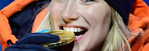 Olympian Biting gold medal