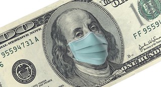 a-100-dollar-bill-with-a-face-mask