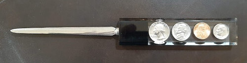 Coins in Lucite letter opener obverse