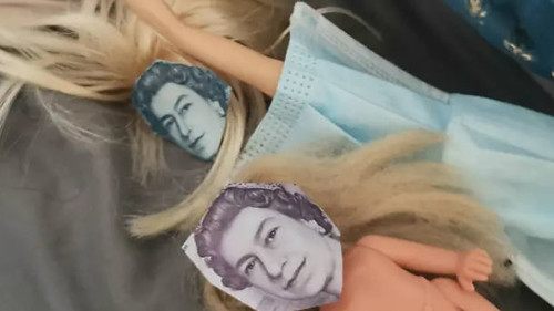 dolls with banknote Queen faces