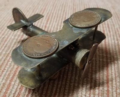 Trench Art coin airplane
