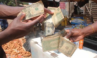 Zimbabwe hustlers trade tattered US notes