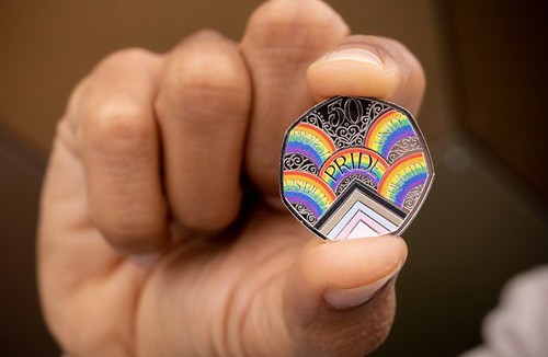 Pride coin in hand